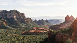 Desert mesas in Arizona with cactus and greenery.