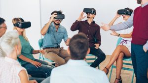 Seven people gather at a special event and wear VR headsets.